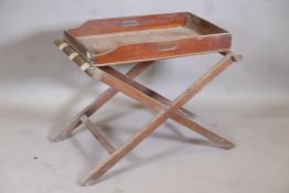 A C19th mahogany butler's tray, 28" x 17" x 4", with associated folding stand