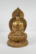 A Chinese filled gilt bronze figure of Buddha, seated on a lotus flower, impressed 4 character