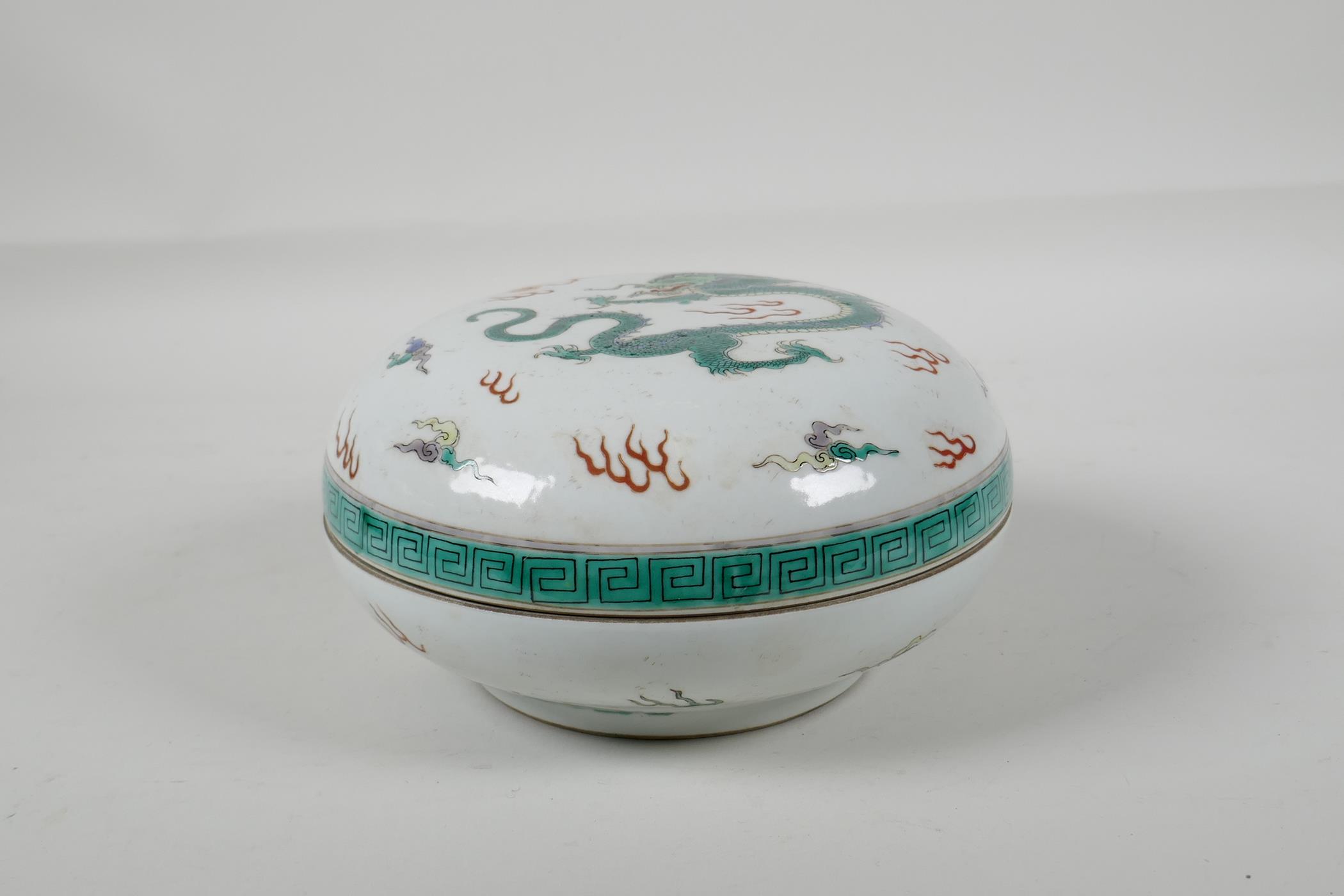 A Chinese Kangxi style famille vert porcelain box & cover, decorated with a dragon chasing the