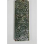 A Chinese green hardstone tablet with carved decoration of the eight immortals and character