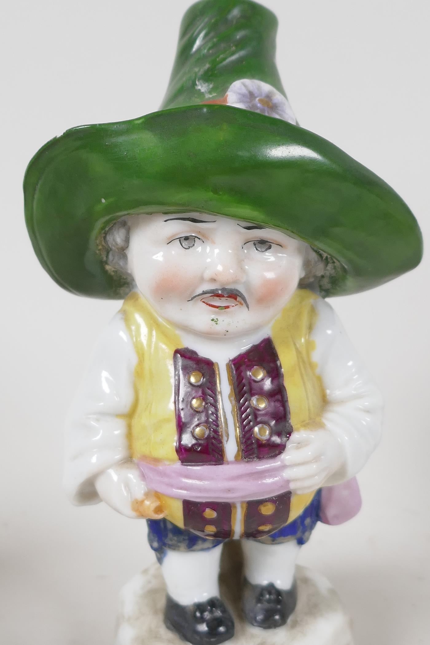 A Continental porcelain figurine of a Dandy holding two puppies, another of a corpulant man in a - Image 5 of 5