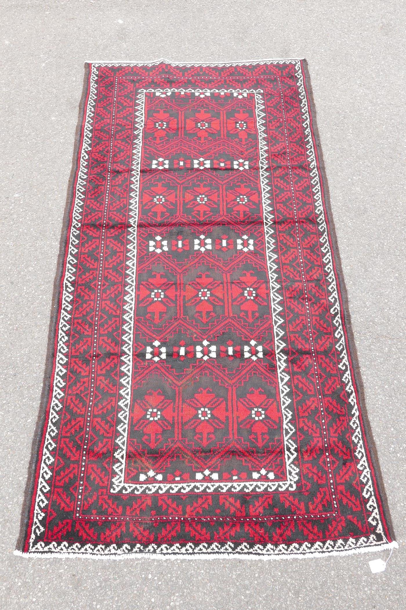 Hand woven full pile red and black ground Iranian Belouch rug, 50½" x 110" - Image 3 of 5
