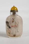 A Chinese reverse decorated glass snuff bottle depicting a wise man and his attendant, character