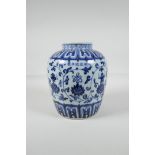 A Chinese Ming style blue and white porcelain jar, decorated with lotus flowers & the Buddhist