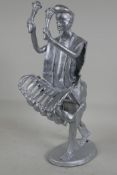 A welded metal figure of a man playing a marimba, 13" high