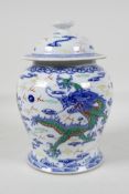 A Chinese polychrome porcelain meiping ginger jar & cover, decorated with dragons chasing the