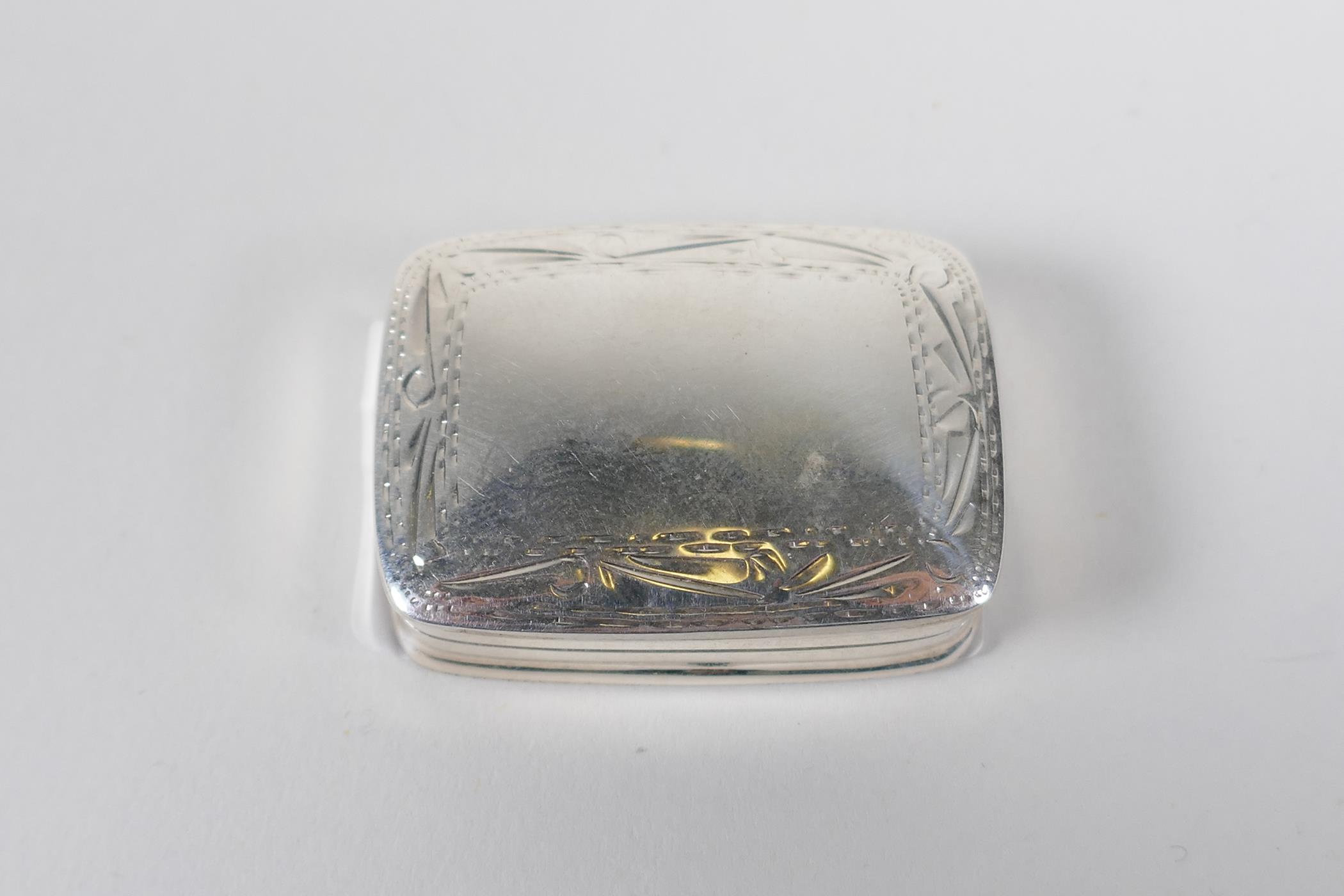 A 925 silver pill box with chased deco to the cover, 1½" - Image 2 of 2