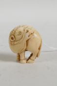 A C19th Japanese carved ivory ram netsuke, signed to base, 1½"