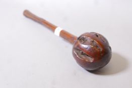 An antique hardwood knobkerrie with carved shaft and good patina, 16" long