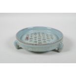 A Chinese Ru-Ware style blue glazed dish on tripod supports, with chased & gilt character