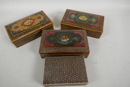 Four middle eastern micro mosaic cigarette boxes with painted covers, longest 6" x 3" x 2"