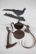 An Arts & Crafts iron candlestick, 7" high, an aluminium "Pheasant" weather vane, a wrought iron