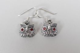 A pair of 925 silver owl earrings with ruby set eyes