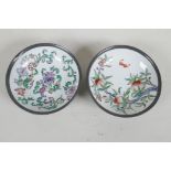 A pair of Chinese porcelain bowls painted with fruit flowers and bats, encassed in pewter frames. 6"