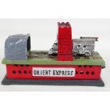 A replica cast iron "Orient Express" train money box, 8½" long