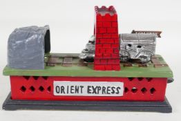 A replica cast iron "Orient Express" train money box, 8½" long