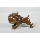 A filled bronze weight in the form of a carton bulldog, 5½" long