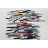 A quantity of assorted ball point pens, mostly Parker