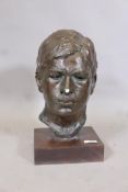Painted plaster head study of a young man, on a wood base, 15" high