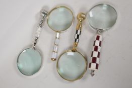 Four desk top magnifying glasses with bone & shell handles. Lens 4" diameter