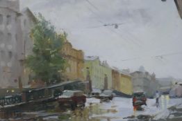 A Russian, oil on board, street scene in the rain. Signed verso, 9½" x 13½"