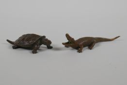 An oriental bronze incense stick holder, in the form of a crocodile. And a Jizai style bronze of a