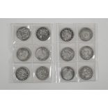 Twelve Chinese facsimile white metal coins/tokens, 14" diameter