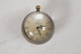 A glass & brass ball, desk top clock, 2¼" diameter
