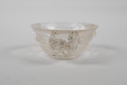 A Chinese carved crystal/glass tea bowl with three kylin handles, 3½" diameter