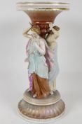 A continental porcelain stand, modelled as the three graces. 12" high