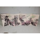 A Chinese concertina book, containing ten mountain and riverside landscapes, overpainted prints