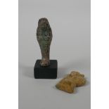 An Egyptian Faience pottery Shabti and a pottery amulet of Khum, 3½" high