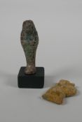 An Egyptian Faience pottery Shabti and a pottery amulet of Khum, 3½" high