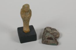 A Egyptian turquoise glazed Faience Shabti and a turquoise glazed pottery amulet of Khum, 3" high