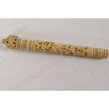 A C19th Canton ivory parasol handle, intricately carved with entwined flowers, 6" long