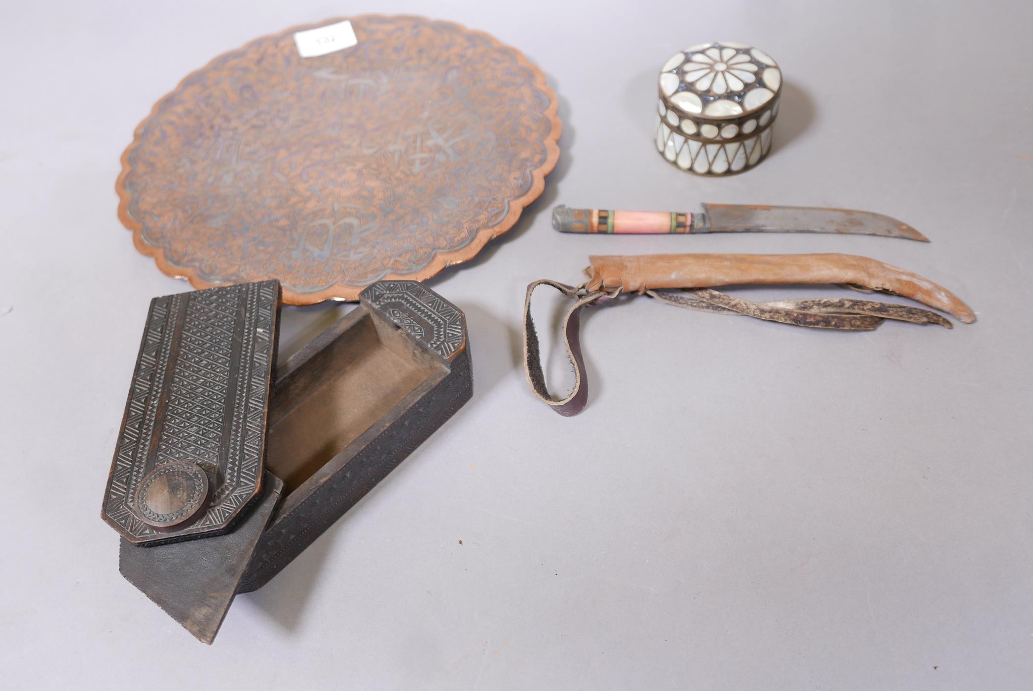 An antique Indian carved wood box with locking cover, a dagger with decorative stained bone