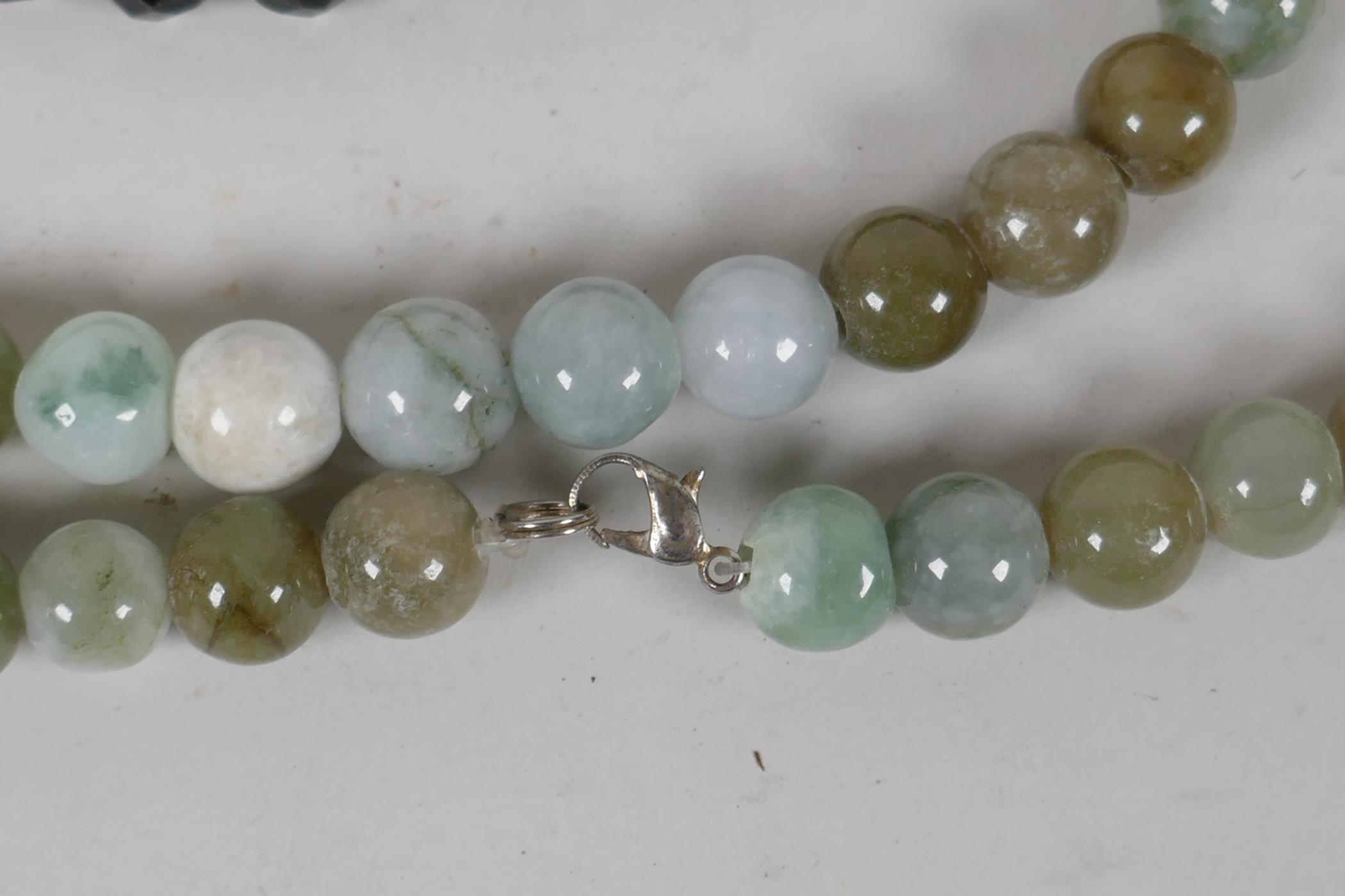 A jade bead necklace, 21½" long, together with a faceted french jet bead necklace, 16" long - Image 2 of 3