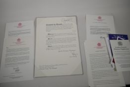 The paperwork and Certificate for the award of an OBE, Bearing the signatures of H.M. The Queen