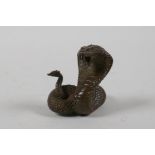 A Japanese bronze Okimono in the form of a cobra, indistinct mark to base, 2" high