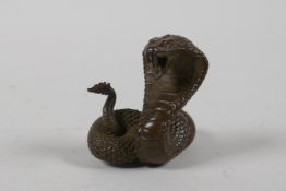 A Japanese bronze Okimono in the form of a cobra, indistinct mark to base, 2" high