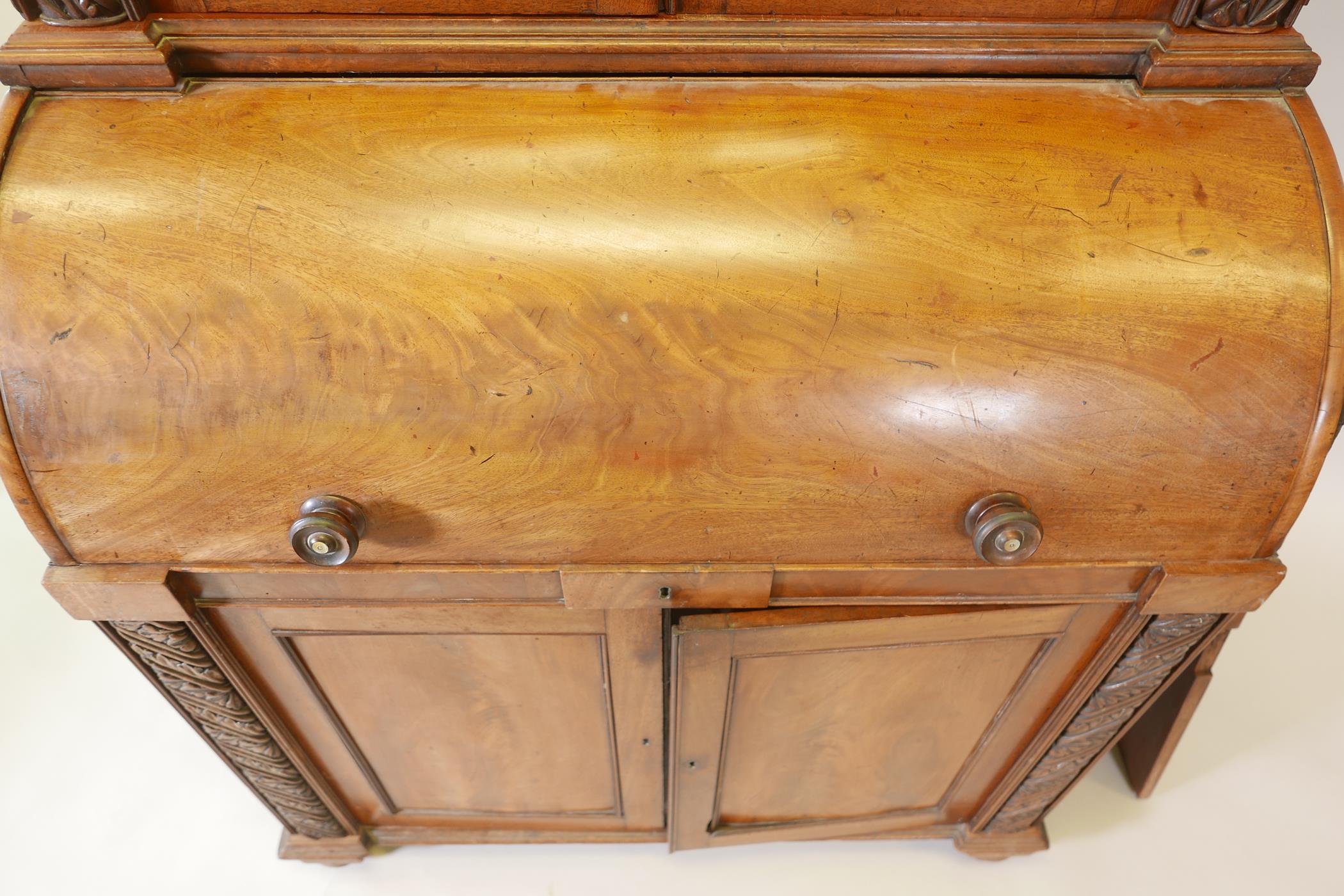 A Victorian cylinder top bureau bookcase, the upper section with two glazed doors and carved - Image 2 of 6