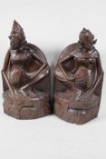 A pair of Balinese hardwood carvings of a young couple, 12" high