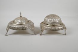 An Indo Persian white metal sweet meat & bonbon dish, with raised figural decoration & tripod lion