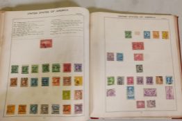 A stamp album containing world stamps, mostly from the late C19th to the 1920's