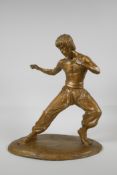 A gilt bronze figure of Bruce Lee, 13" high