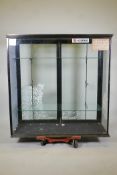 Antique shop glass display cabinet, with cast metal adjustable shelf supports & two glazed doors