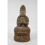 A Chinese carved, painted and distressed wood Buddha seated on a lotus flower in meditation, 14"