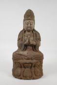 A Chinese carved, painted and distressed wood Buddha seated on a lotus flower in meditation, 14"