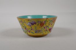 A Chinses polychrome porcelain bowl with a lobed rim, decorated with bats and auspicious symbols