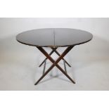 A beechwood coaching table, bears label, Thornton and Herne, Cadogan Place, Pont Street, SW, 40"